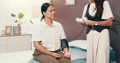Buy stock photo Doctor, monitor and blood pressure with women in hospital for healthcare advice, consulting and cardiovascular results. Medical assessment, hypertension diagnosis and wellness with people in clinic