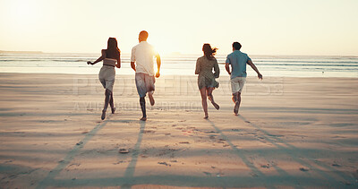 Buy stock photo Running, sunset and back of friends on beach for tropical vacation, break or holiday together. Freedom, energy and group of people by ocean for seaside weekend trip for travel with activity in summer