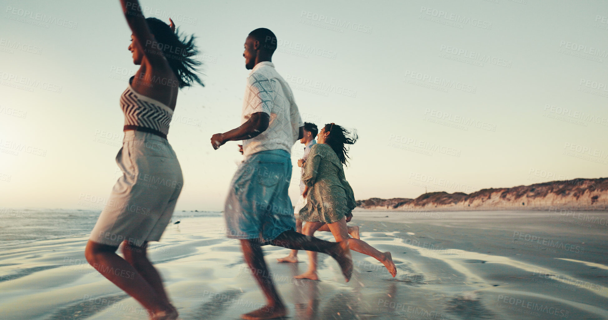 Buy stock photo Running, sunset and friends on beach for vacation, break or holiday together on island. Freedom, energy and group of people by ocean for seaside weekend trip for travel with activity in summer