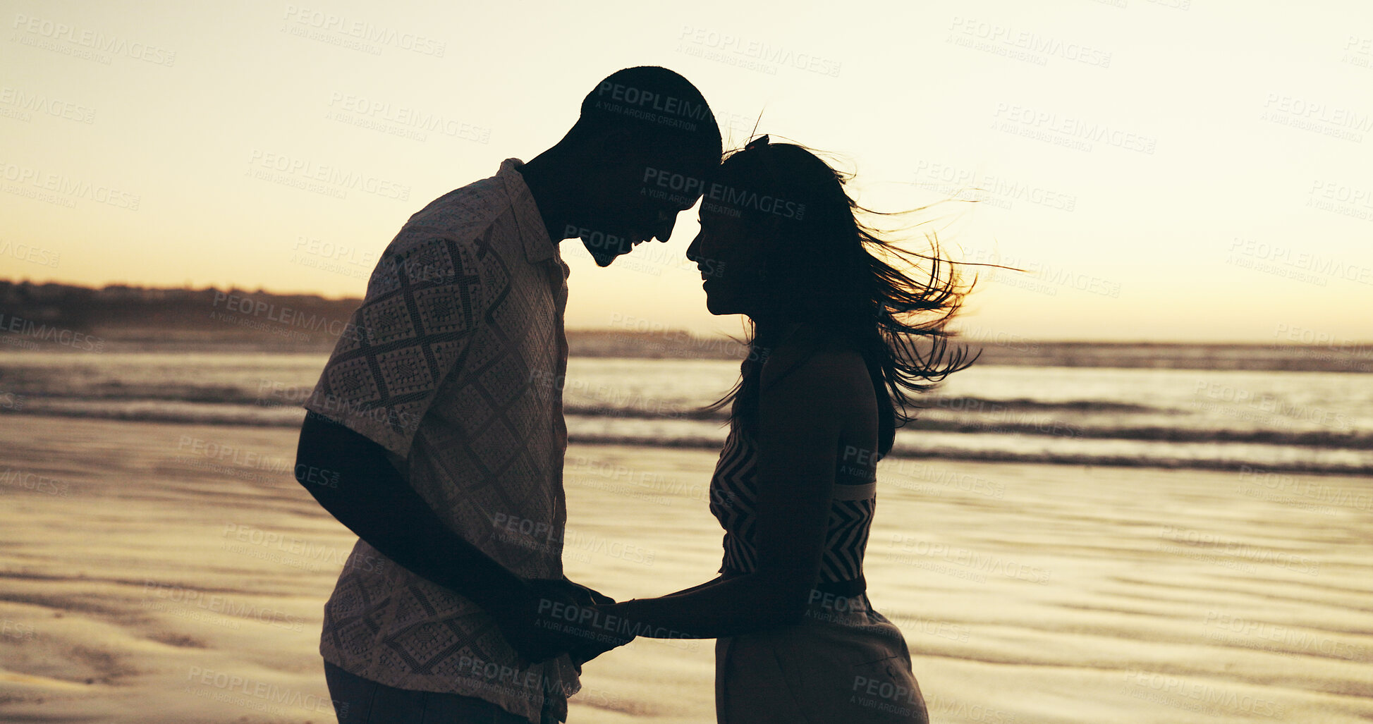 Buy stock photo Couple, holding hands and love with sunset on beach for summer vacation, romantic date and bonding. Happy, people and travel of tropical holiday, partner affection or relationship commitment at ocean