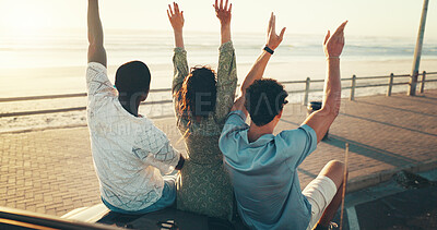 Buy stock photo Hands raised, road trip and travel with friends at beach together for bonding, holiday or vacation. Adventure, freedom and transport with group of people outdoor on coast for weekend from back