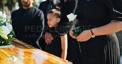 Buy stock photo Hand, flower and woman by coffin for funeral ceremony, grief and memorial service outdoor with family. Rose, death and person by casket at graveyard for mourning, peace and farewell with respect