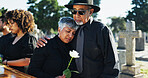 Hug, loss and funeral with people, graveyard and grief with burial, mental health and sorrow. Ceremony, outdoor and family with empathy, support and comfort with compassion, mourning and embrace