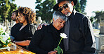 Embrace, sad and funeral with people, graveyard and grief with emotion, empathy and  sorrow. Ceremony, outdoor or family with loss, support or comfort with compassion, mourning or burial for death