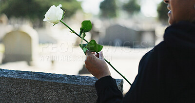 Buy stock photo Hand, flower and person at gravestone for funeral, grief and memorial service outdoor at cemetery for farewell. Graveyard, death and rose on tombstone for mourning, peace and respect for remembrance