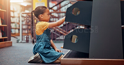Buy stock photo Shelf, search and child with books in library for reading story, literature and learning. School, bookstore and girl on floor with decision or choice for knowledge, education and language development
