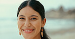 Portrait, smile and woman at sea for holiday, vacation and travel outdoor for adventure. Beach, face and happy female person in nature at ocean for trip, summer and tourist relax on island in Spain