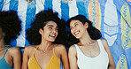 Friends, happy women and relax on blanket at beach for vacation, holiday and travel with top view. Girls, smile and outdoor together at coast above for funny conversation, laugh or bonding in summer