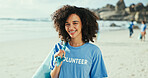 Girl, portrait and volunteer for cleaning at beach with smile, outdoor and environment on earth day. Woman, plastic bag and happy by sea for accountability with recycling, dirt and waste management