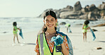 Woman, smile and plastic bag for cleaning beach in portrait, outdoor and earth day with care for environment. Girl, volunteer and happy by ocean with accountability for trash, garbage and dirt