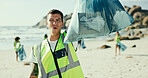 Man, portrait or volunteer with bag on beach for recycling, eco friendly environment or earth day. Male person, activist or community service with garbage or dirt for save planet or world charity