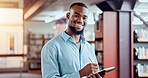 Portrait, learning and happy man with tablet in library for knowledge, education and studying in college. Technology, bookstore and African student in university with pen for academic research online