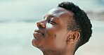 Black man, peace and breathing to relax with fresh air at beach for break, tranquility or natural oxygen. Calm, profile or person on holiday at ocean coast for vacation mockup or outdoor meditation