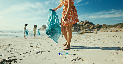 Buy stock photo Hands, plastic bottle and volunteer at beach for pollution, bag and accountability with dirt in environment. Person, waste and legs with trash, rubbish and garbage on earth day by ocean in summer