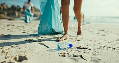 Buy stock photo People, volunteer and beach with plastic for recycling, eco friendly environment or earth day. Legs, activist or community service with charity workers for pollution, litter or cleaning ocean coast