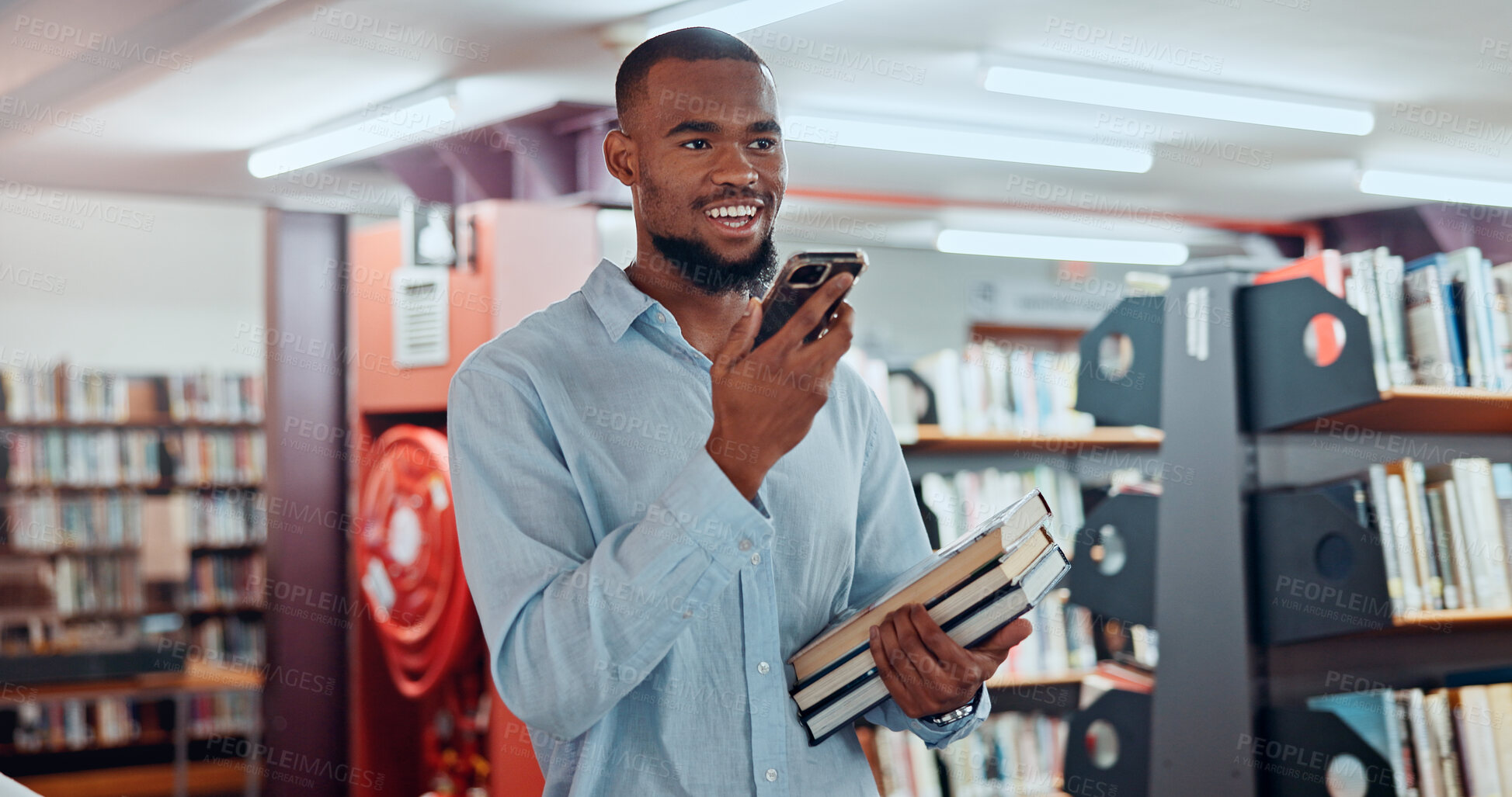 Buy stock photo Man, phone and books with recording at library with voice notes, contact or happy with studying at college. African person, university student and smile for memo, reminder or scholarship for learning