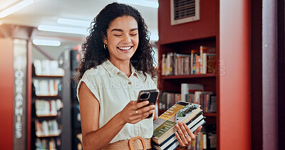 Buy stock photo Woman, phone and books with texting at library with smile, contact and excited with studying at college. Girl, person and university student with smartphone, mobile app or social media at academy