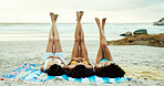 Beach, women and friends relax with legs up on holiday, vacation or travel together on tropical island. Outdoor, girls and group lying by ocean on blanket for rest, sunbath or tan in summer with feet