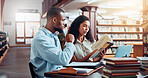 University, books and people in library on laptop for online research, information and studying for project. College, students and man and woman with notes for education, knowledge and learning