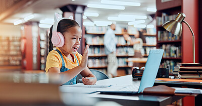 Buy stock photo Child, girl and laptop for video call in library, online education class or elearning with wave for academic development. Student, kid and virtual school with hello, headphones and learn for growth