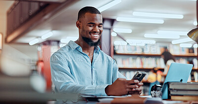 Buy stock photo Smile, black man and student with phone in library for social media, reading chat and university app. Person, mobile and communication for learning, scholarship application and studying notification