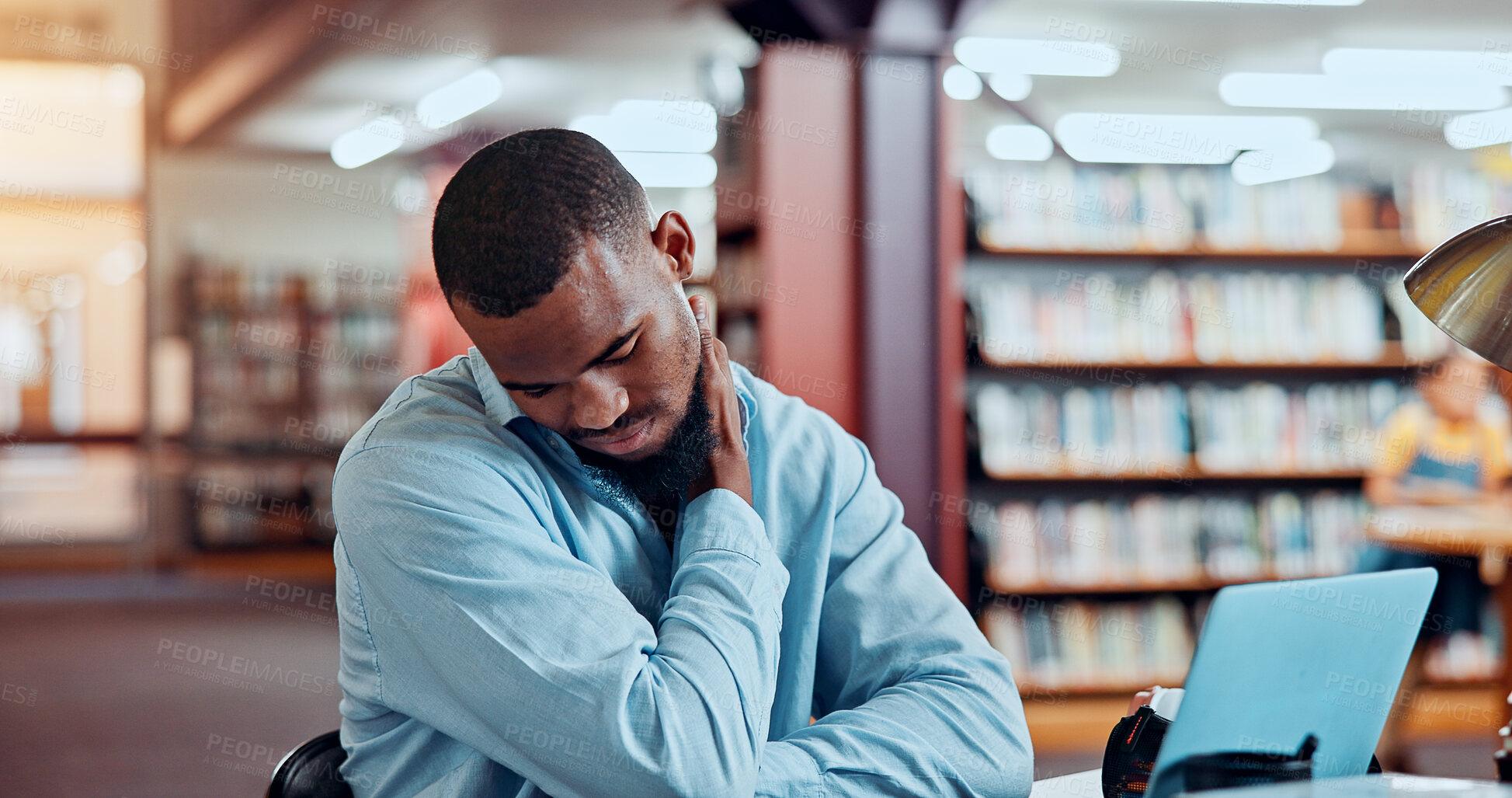 Buy stock photo Black man, laptop and neck pain in library for education, research or project deadline for university student. African person, stress and anxiety with strain on campus for overtime, burnout or report