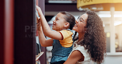 Buy stock photo Mom, girl and help by bookshelf at library with lift, smile and support for education, development and reading. Family, mother and daughter with search for book, story and literature for learning