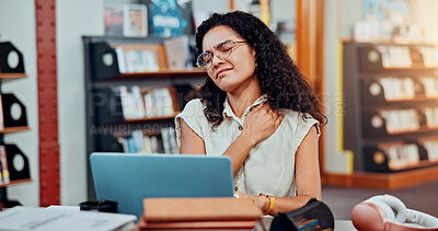 Buy stock photo Woman, laptop and neck pain in library for university, research or project deadline for student education. Female person, stress and anxiety with strain on campus for overtime, burnout or report