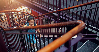 Buy stock photo Child, girl and stairs in library for education, student walking for learning and knowledge at academy campus. Scholarship, growth and development, story time in bookshop or literacy study at school