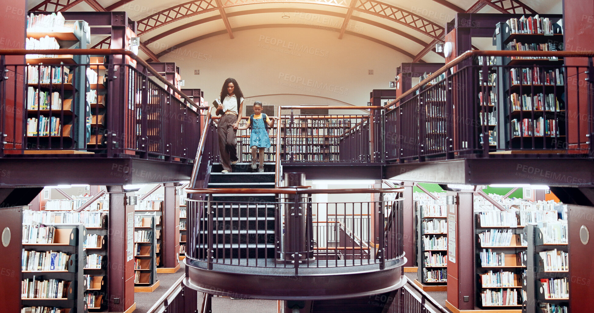 Buy stock photo Woman, girl and library stairs with walk for information, learning or knowledge for academic tutor. Book session, student development and education with mother, scholarship and people for study