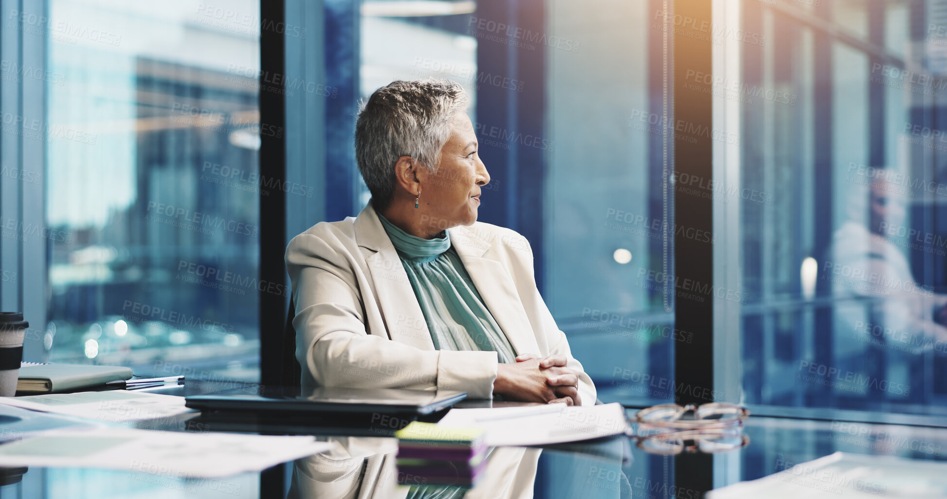 Buy stock photo Business, woman and thinking by window at desk for investment decision, proposal inspiration or vision. Finance manager, mature person or happy in office with financial insight or funding opportunity