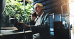 Business, mature man and phone call in office with discussion, schedule update and finance contact. Accountant, tablet and listening on mobile, proposal feedback and negotiation with investment offer