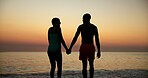 Sunset, smile and couple holding hands on beach of summer vacation, tropical journey and romantic. People, shadow and water for adventure, ocean travel and relationship commitment for getaway holiday