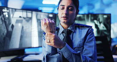 Buy stock photo Wrist pain, security guard and woman with strain, frustrated or cctv screen in night shift for safety. Arthritis, carpal tunnel or person with video surveillance in control room for protection agency