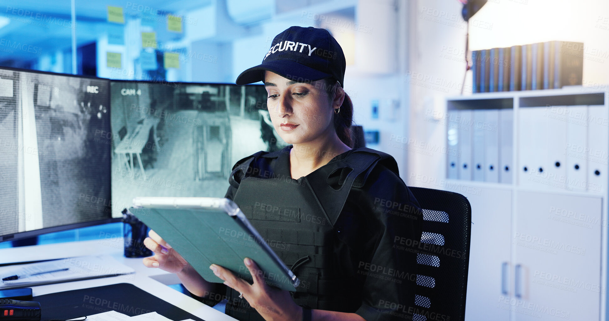 Buy stock photo Security guard, woman and tablet with surveillance video, observation app and watching at night. Officer, cctv station and technology in control room for monitor, safety or footage for protection