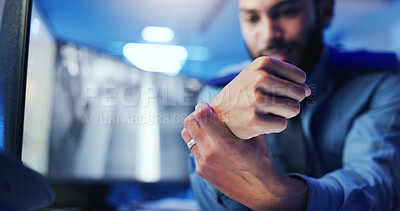 Buy stock photo Wrist pain, security guard and hand with man, frustrated or cctv screen in night shift for safety. Arthritis, carpal tunnel or person with video surveillance in control room for protection agency