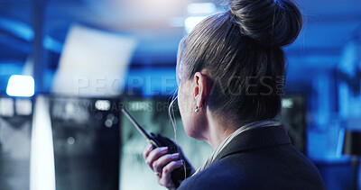 Buy stock photo Control room, surveillance and woman with radio, night and back of security guard with footage and online. Watching, video and person with tech for communication, bodyguard and observation for safety