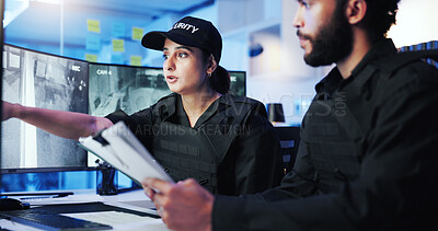 Buy stock photo Night, security team and discussion at computer for feedback, advice or standard procedure in control room. Man, woman guard or paperwork in office for protocol rundown, service or tech on late shift