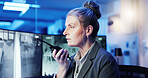 Surveillance, control room and woman at computer screen with radio, information and contact. CCTV, night security and mature officer with wireless communication, intelligence report or command center