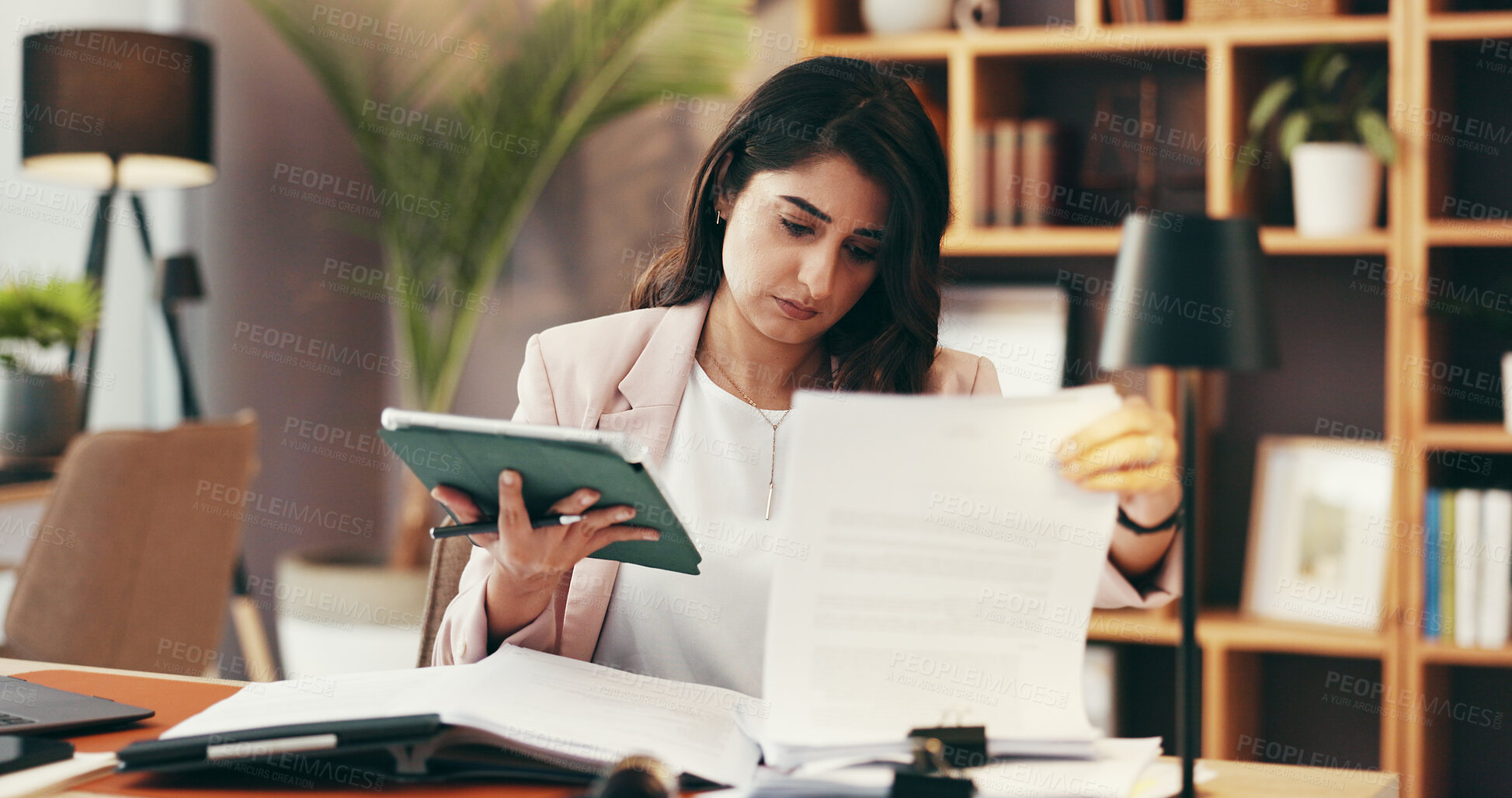 Buy stock photo Woman, tablet and paperwork in office for business, contract review and case study in law firm. Lawyer, technology and legal document in agency for planning, compare research and administration