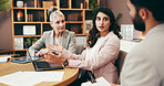 Meeting, laptop and business people in office for planning with creative project in collaboration for publishing. Teamwork, computer and editors with manager for feedback or review in workplace.
