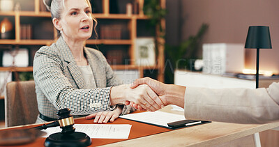 Buy stock photo Woman, lawyer and handshake in office for welcome, legal agreement and thank you in meeting. Mature attorney, client and shaking hands in law firm for negotiation, contract renewal and introduction