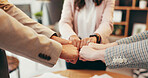 Team, hands and business people with fist bump in office for support, mission or motivation for group project. Huddle, solidarity and synergy with trust, cooperation and corporate collaboration 
