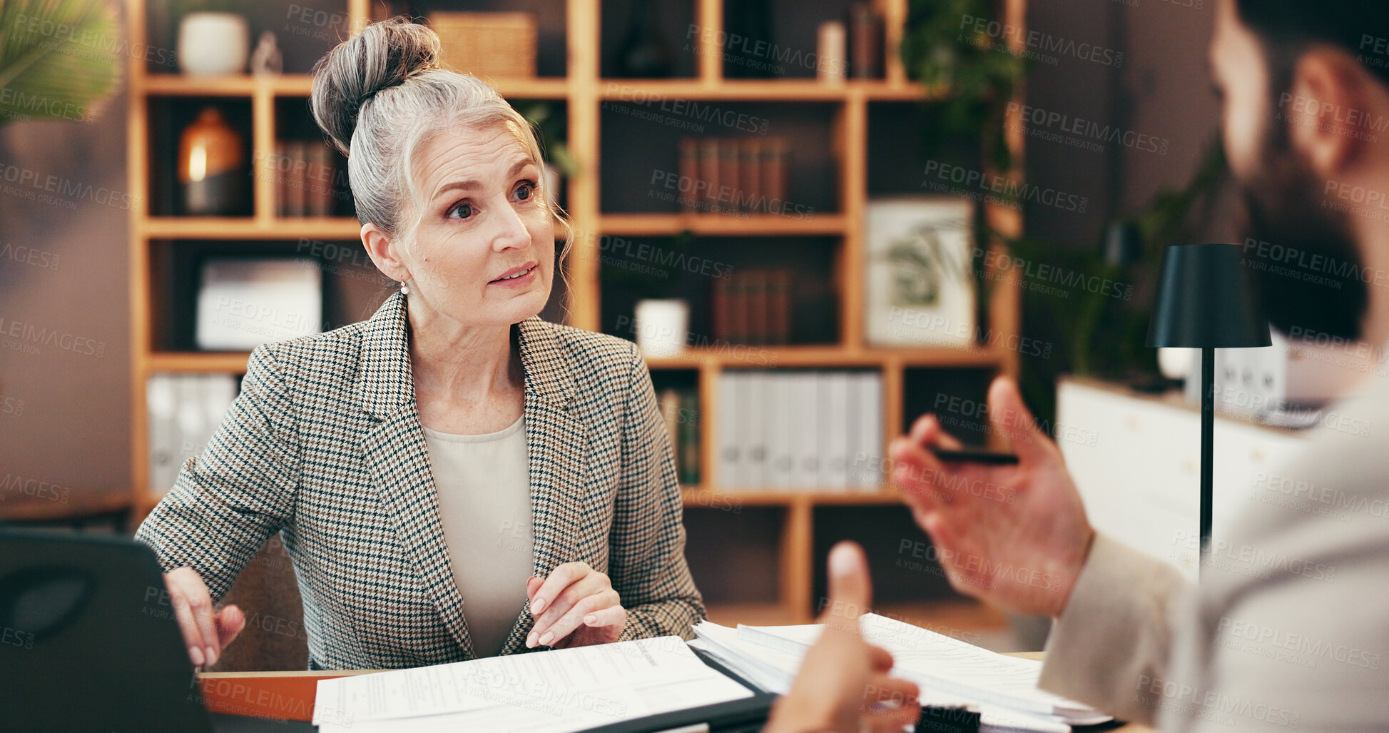 Buy stock photo Meeting, people and explain with documents in office for legal consulting, planning and corporate advice. Mature woman, attorney and paperwork for settlement, information and procedure for management