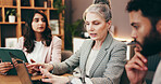 Meeting, laptop and business people in office with creative project in collaboration for publishing. Teamwork, computer and group of editors with manager for feedback, review or advice in workplace.