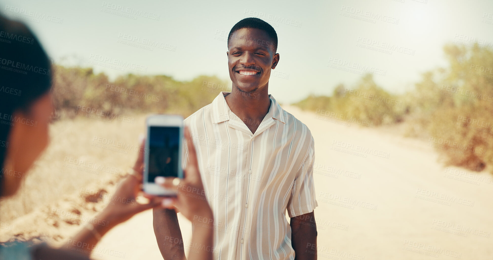 Buy stock photo Outdoor, travel and picture of couple with phone for holiday memory, vacation or smile on journey. Man, woman and mobile for photograph on trip in desert, safari adventure and post on social media