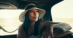 Road trip, passenger and woman with hat in car for travel adventure, sightseeing or safari tour in countryside. Exploring, tourist and driving in nature with holiday scenery, weekend break or getaway