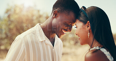 Buy stock photo Couple, happy and touch forehead at safari with connection, love and romance on holiday in summer. African people, woman and man with smile for bonding, excited and anniversary on vacation in Kenya