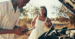 Road, couple and phone for car breakdown with engine fail, gas or travel disaster, battery or stress. Man, smartphone and conversation for assistance, help and emergency or insurance claim for towing