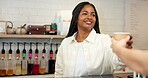 Cafe, barista and woman with coffee, customer and smile for sale in store, hospitality or morning. Shop, waitress and person with latte for consumer, happy and checkout for takeaway or small business